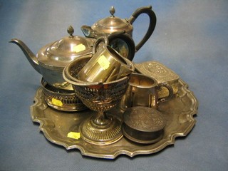 A silver plated hotwater jug and matching teapot, a pierced silver plated bottle coaster and other plated items