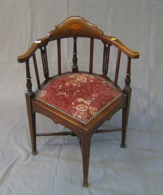An Edwardian inlaid mahogany corner chair with turned decoration and X framed stretcher