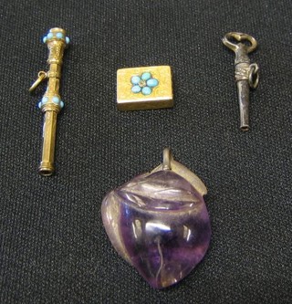 A "gold" pendant set turquoise and diamonds, a gilt metal propelling pencil, a polished steel watch key and a plum coloured glass pendant