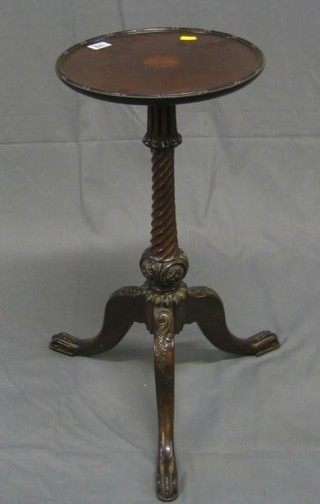 A handsome 19th Century mahogany kettle stand with inlaid mahogany top, raised on a spiral turned mahogany column and tripod base with egg and claw feet (1 with old repair)