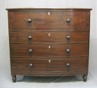 A Victorian mahogany bow front chest of 4 long drawers with ivory escutcheons, tore handles, raised on turned feet 50"