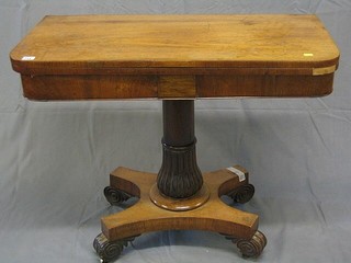 A William IV rosewood card table raised on a turned column and triform base with scrolled feet 36"