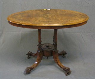 A Victorian oval inlaid figured walnutwood Loo table, raised on 4 turned columns with outswept supports 36"