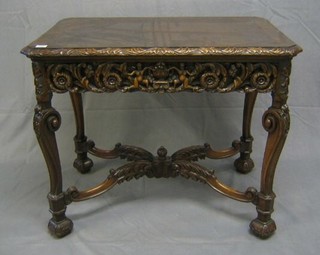 An  Italian carved walnutwood centre table with crossbanded top, heavily carved cherubs throughout, fitted 2 drawers to the side, raised on scrolled supports united by X framed stretcher 35"