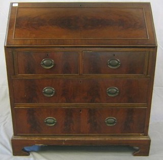 A 19th Century Georgian style bureau with fall front revealing a well fitted interior above 2 short and 2 long drawers, raised on bracket feet 36"