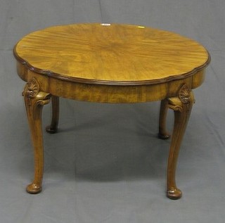 A 1930's figured walnutwood Queen Anne style circular coffee table, raised on cabriole supports 27"