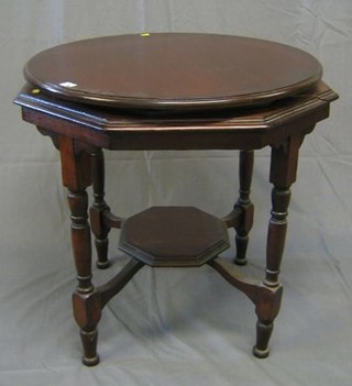 An Edwardian octagonal mahogany occasional table, the top fitted a circular Lazy Susan, raised on turned supports with octagonal undertier 29"