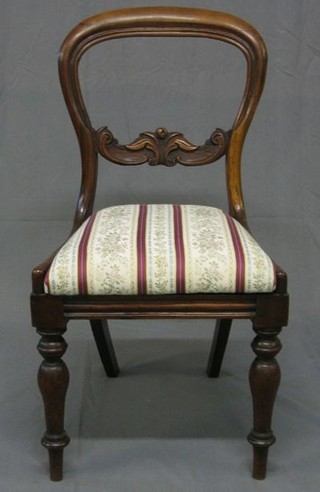 A set of 3 Victorian mahogany balloon back dining chairs with carved mid rails and upholstered seats on turned supports