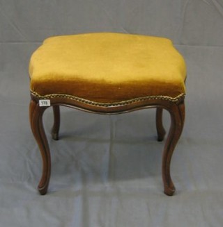 A Victorian style show frame mahogany stool of serpentine outline, raised on cabriole supports 22"