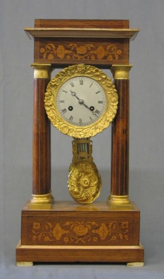 A 19th Century French 8 day striking "Portico" clock with silvered dial, Roman numerals contained in an inlaid rosewood case with gilt metal mounts