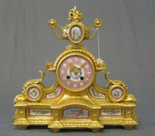 A 19th Century French 8 day striking mantel clock contained in a gilt metal case surmounted by a lidded urn and with pink "Sevres" porcelain panels