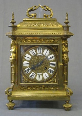 A French 19th Century 8 day striking bracket clock contained in a gilt metal case with carrying handle, the plaque dial with Roman numerals by Lerolle Freres Paris