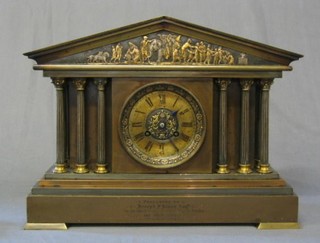 a Victorian French 8 day striking mantel clock with Roman numerals contained in a polished metal architectural case, raised on bracket feet