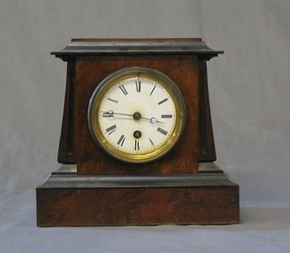 A 19th Century French 8 day mantel clock with porcelain dial contained in a stepped walnutwood case