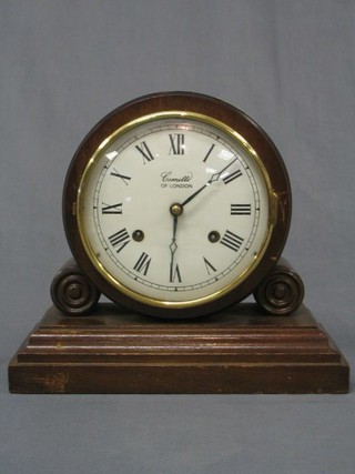 A 20th Century 8 day striking mantel clock with enamelled dial and Roman numerals by Comitti of London