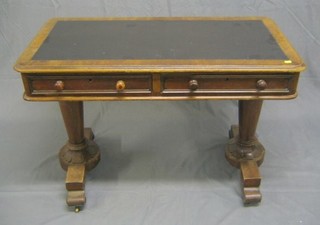 A 19th Century mahogany writing table with inset tooled leather writing surface, fitted 2 drawers, raised on turned chamfered columns 42"