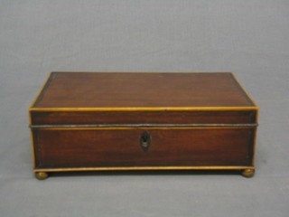 A Georgian rectangular mahogany trinket box, the top crossbanded with satinwood, raised on 4 bun feet 9"