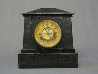 A 19th Century American 8 day striking mantel clock with visible escapement contained in a carved oak Egyptian style case