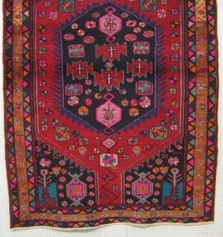 A contemporary multi coloured Persian Hamadan carpet the central medallion signed 91" x 63"