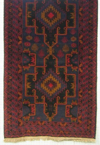 A contemporary green and red ground rug within multi-row borders 79" x 43"