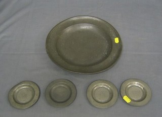 An 18th/19th Century circular pewter plate, the base with touch mark, 11 1/2" and 4 circular pewter dishes, the bases marked X, London? 4"