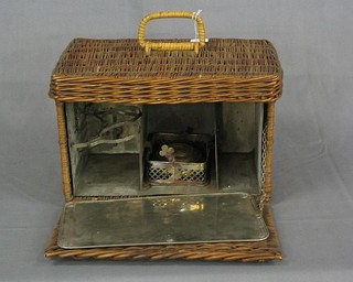 A 1920's rectangular wicker Primus stove  box with hinged lid, fitted a metal divider with 3 sections 13"