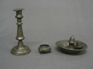 An 18th/19th Century pewter candlestick with ejector 9", a circular pewter chamber stick and snuffer and a salt
