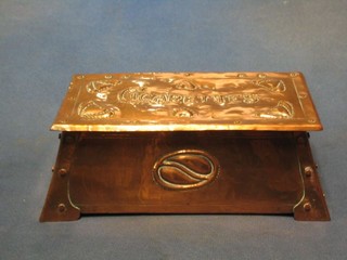 An Art Nouveau embossed copper cigarette box with hinged lid, on outswept bracket feet 8"