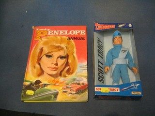 A Lady Penelope annual and a Matchbox Thunderbirds figure, boxed