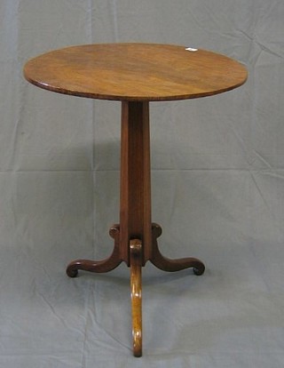 A circular 19th Century "rosewood" wine table, raised on a chamfered column and tripod base 24"