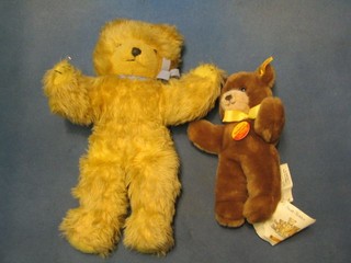 A modern original brown Steiff teddybear 10" together with a Wendy Boston yellow teddybear 14"