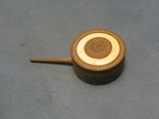 A circular metal de-lousing puffer