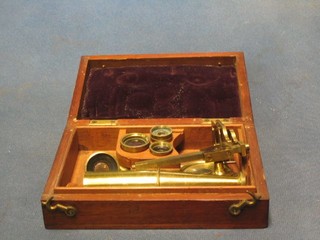 A 19th Century student's single pillar microscope contained a mahogany case with hinged lid