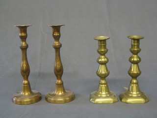 2 pairs of brass candlesticks, 3 shell cases and a pair of fire dogs and other sundry items of metalware