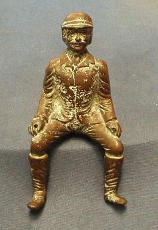 A bronze figure of a seated carriage driver 6"