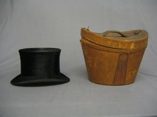 A gentleman's small black silk top hat with leather carrying case