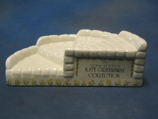 A Royal Doulton Kate Greenaway collection stand