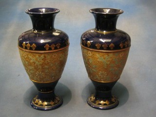 A pair of Royal Doulton blue salt glazed baluster shaped vases, the bases marked Doulton Slater, 13"