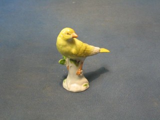 A "Meissen" porcelain figure of a seated bird, 4", the base with cross swords mark and impressed 77262