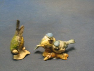 A Goebal figure of a Blut Tit 4" and a biscuit porcelain figure group of 2 birds 