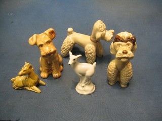 A Sylvac model of a standing Poodle 5", a Sylvac model of a seated Poodle 5" and a Sylvac model of a dog 5", a Wade figure of a white fawn 5" and a Wade figure of a seated horse 3"