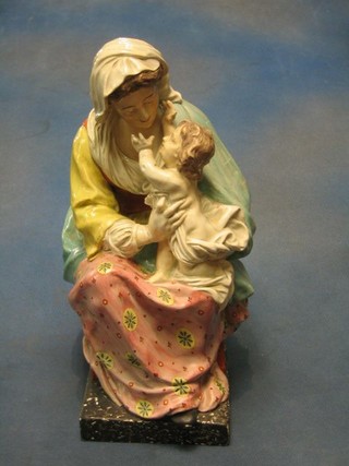 A fine quality 18th/19th Century Staffordshire figure of a seated mother and child 12"