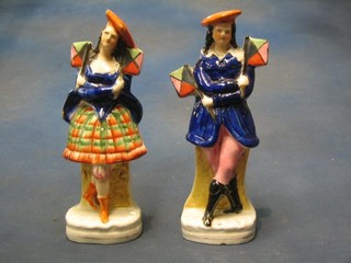 A pair of 19th Century Staffordshire pottery figures of a lady and gentleman semaphore 9" (1 f and r)