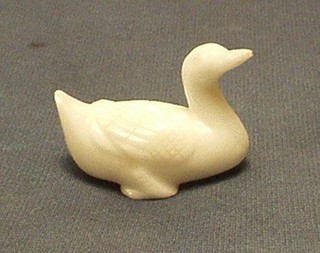 An Oriental white glass figure of a seated duck 2"