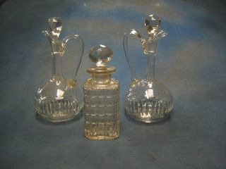 A square hobnail cut glass spirit decanter and 2 wine ewers and stoppers