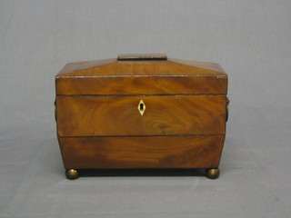 A handsome Georgian mahogany twin compartment tea caddy of sarcophagus form with embossed brass handles, raised on bun feet 9"