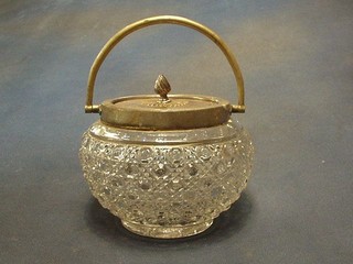 A cut glass biscuit barrel with silver plated mounts
