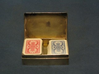 An Edwardian rectangular silver card box with hinged lid London 1900 3 1/2", 3 ozs, containing 54 miniature red playing cards and 51 miniature blue playing cards