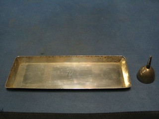 A rectangular silver snuffer tray, London 1929, 9" and a silver plated perfume funnel
