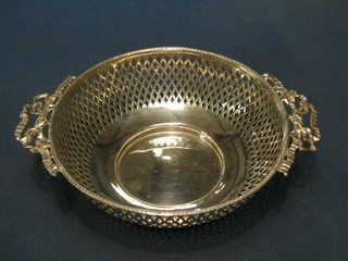 A circular pierced silver twin handled bowl, Birmingham 1910, 4 ozs